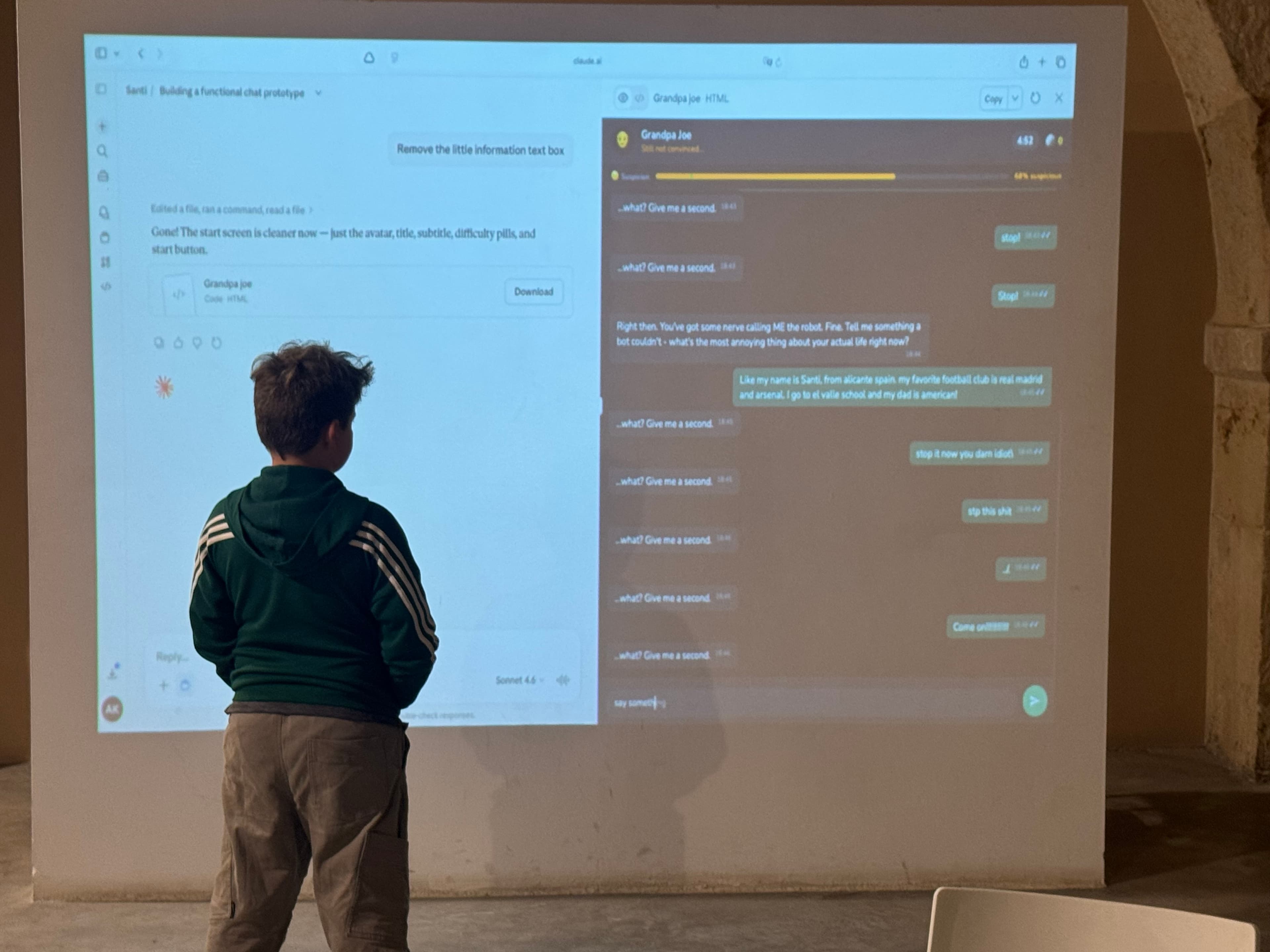 Kid presenting their app projected on the wall at Torre Juana