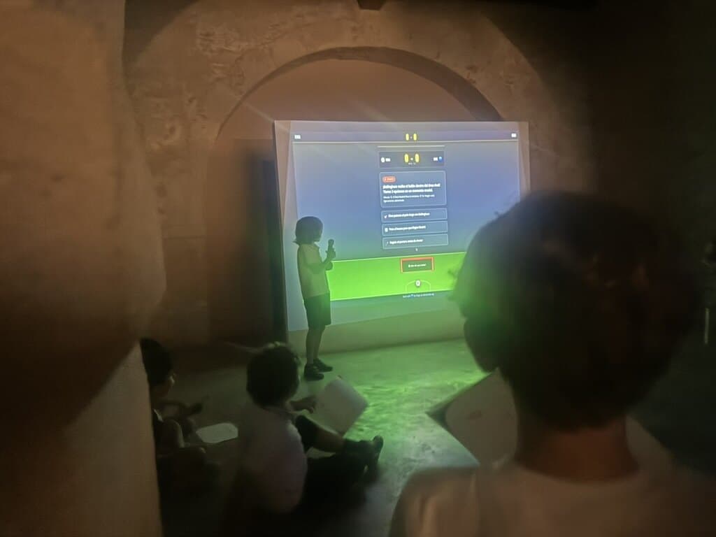 A young Builder presenting a football project on the projector