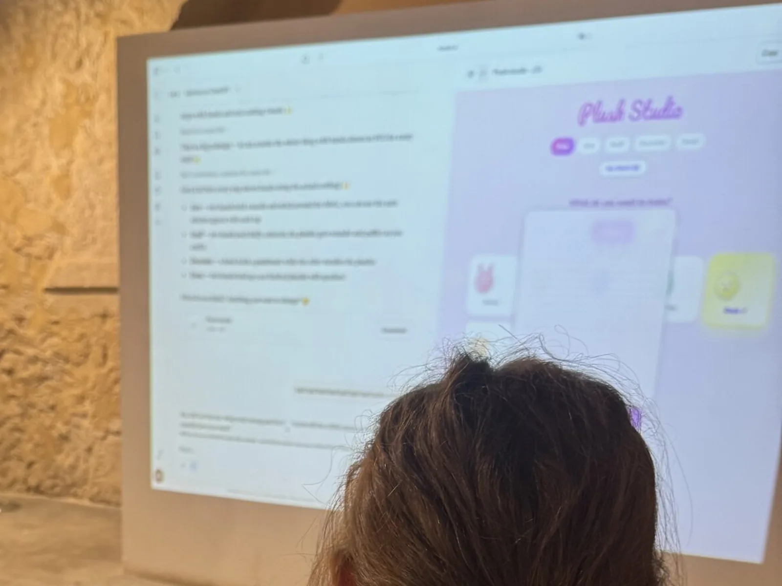 A student building her app in Spark, projected on the wall of an AI Kids Club session at Torre Juana