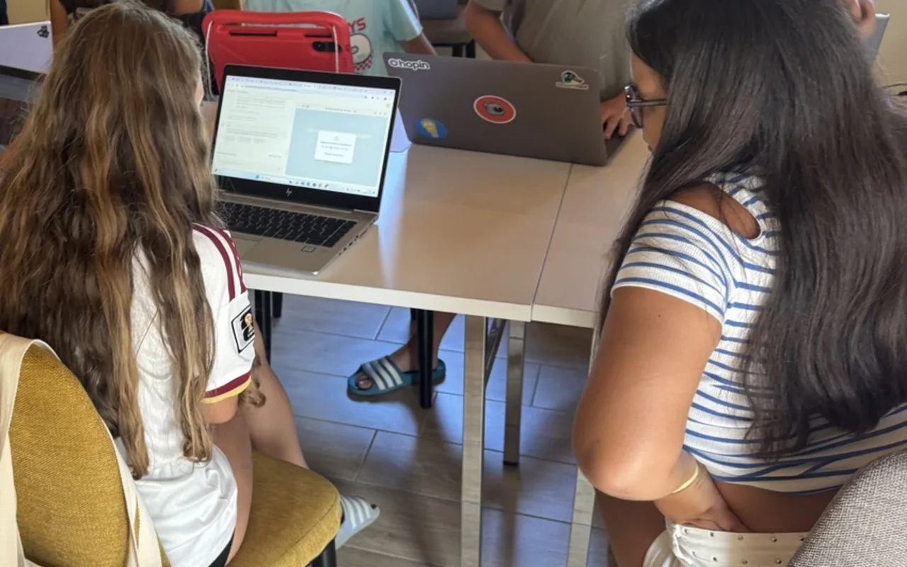 The oldest in the group, a laptop each.